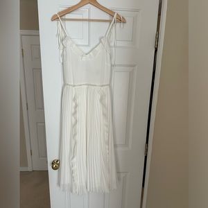 Wore one time. Beautiful white dress that’s elegant. Bought off Revolve for $129